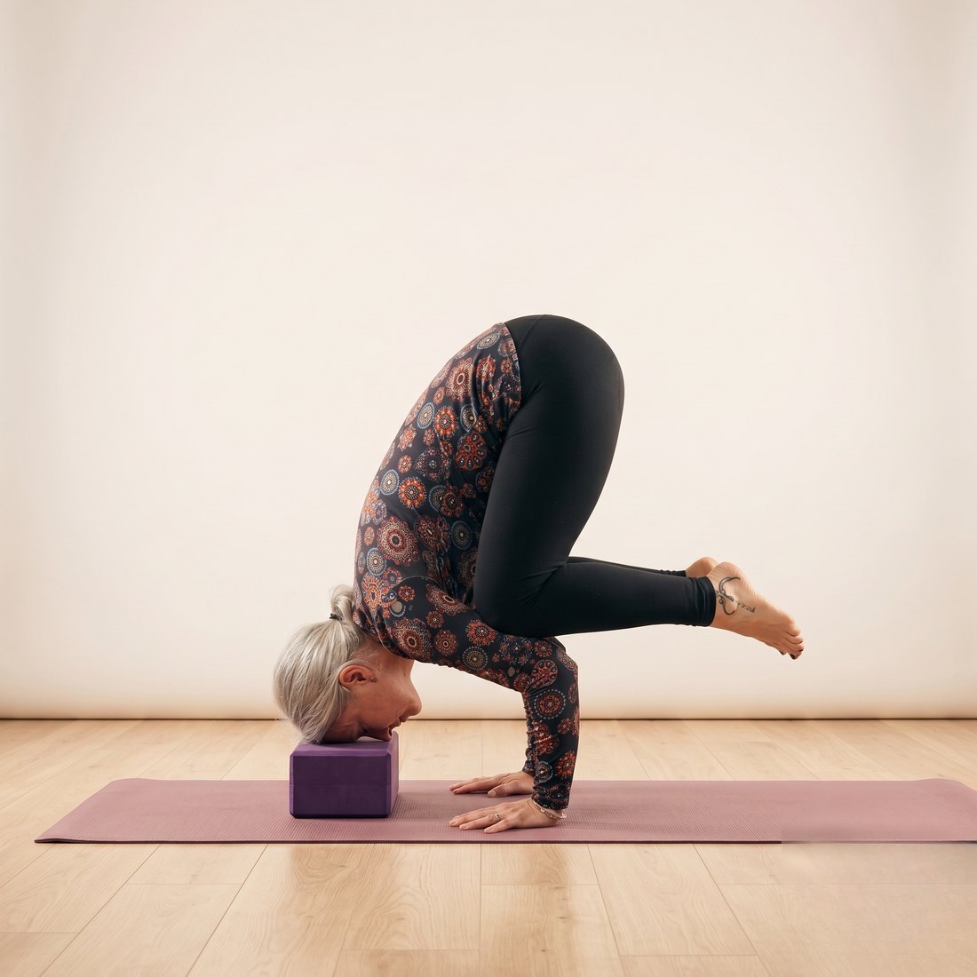 Michelle demonstrating Crow Pose